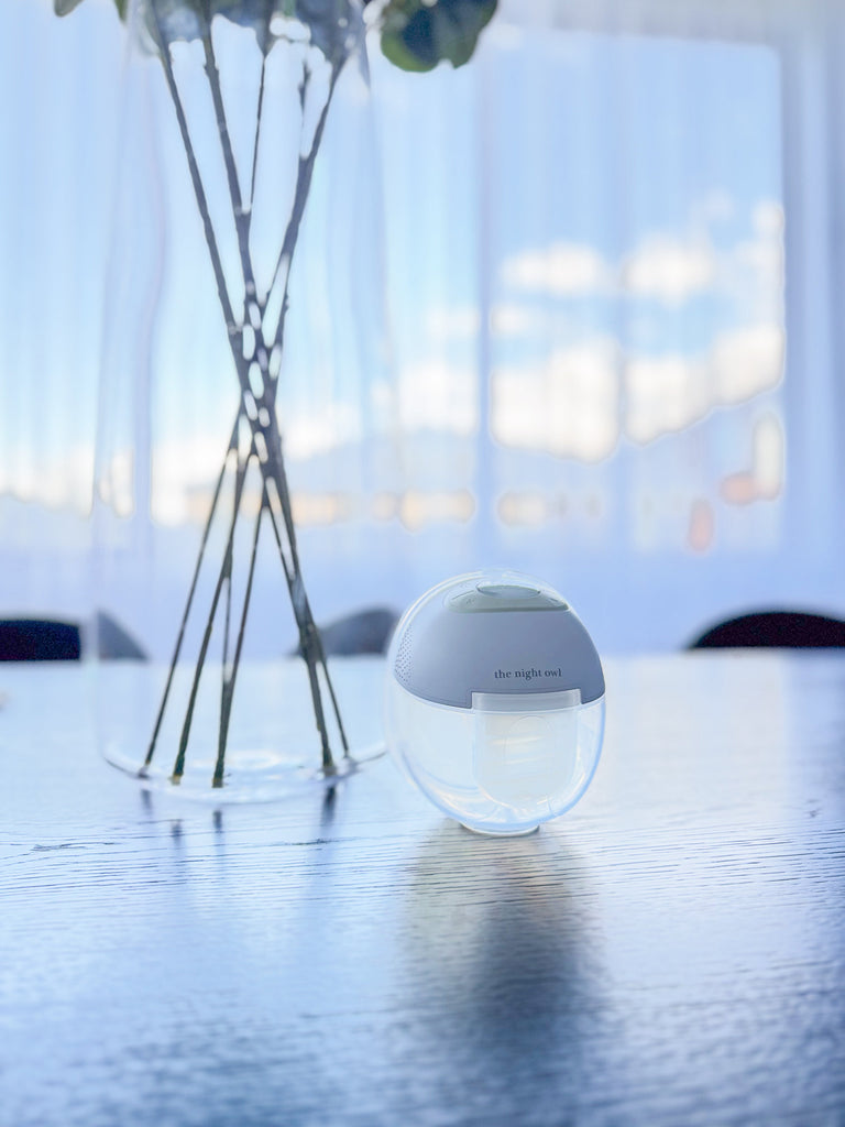 Night Owl wearable breast pump displayed with elegant home decor, representing modern breastfeeding solutions beyond outdated myths