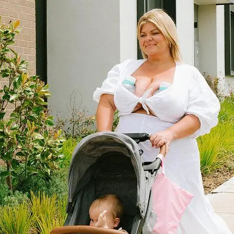  Working mother balancing career and motherhood while using Night Owl wearable breast pump to manage busy lifestyle with children